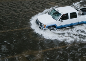truck driving through high water